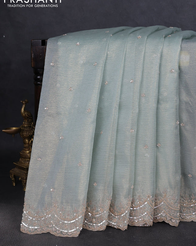 Crush tissue saree pastel blue and wiith allover sequin work and embroidery border
