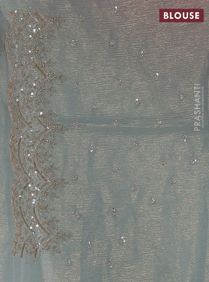 Crush tissue saree pastel blue and wiith allover sequin work and embroidery border