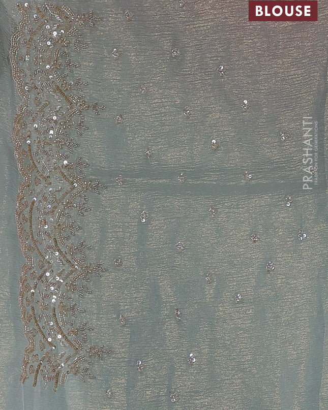 Crush tissue saree pastel blue and wiith allover sequin work and embroidery border