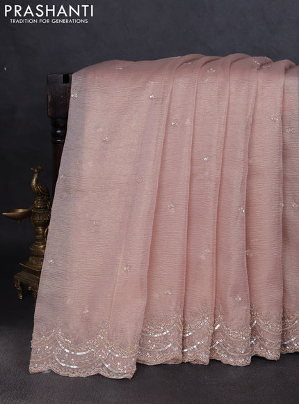 Crush tissue saree mild peach and wiith allover sequin work and embroidery border