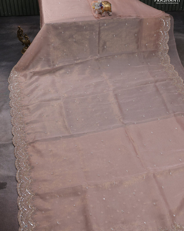 Crush tissue saree mild peach and wiith allover sequin work and embroidery border