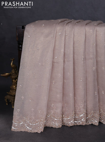 Crush tissue saree grey and wiith allover sequin work and embroidery border