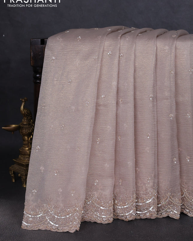 Crush tissue saree grey and wiith allover sequin work and embroidery border