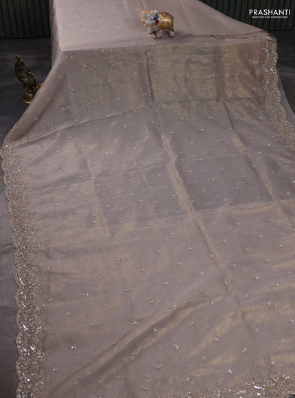 Crush tissue saree grey and wiith allover sequin work and embroidery border