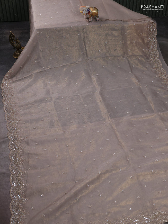 Crush tissue saree grey and wiith allover sequin work and embroidery border