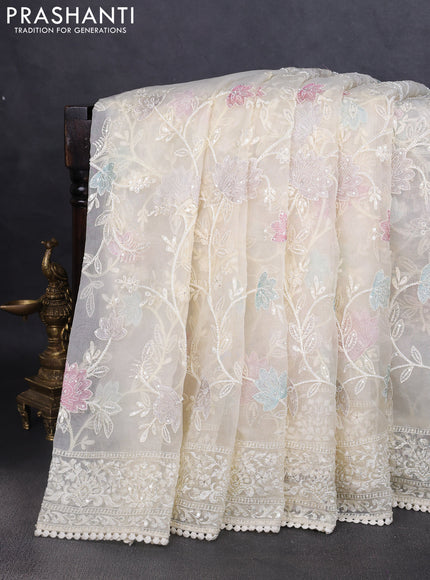 Organza saree cream with allover embroidery and embroided border