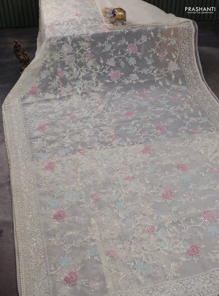 Organza saree cream with allover embroidery and embroided border