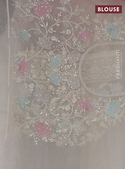 Organza saree cream with allover embroidery and embroided border