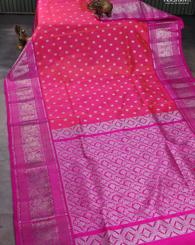 Venkatagiri silk saree dual shade of pinkish orange and pink with allover silver zari woven buttas and silver zari woven border