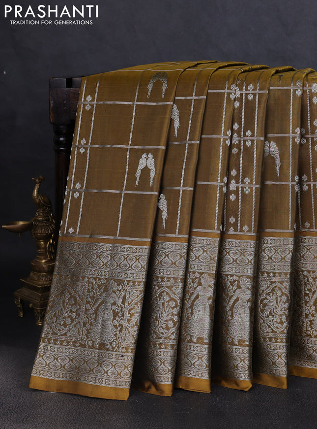 Venkatagiri silk saree mehendi green with allover silver zari checks & buttas and long silver zari woven border