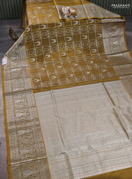 Venkatagiri silk saree mehendi green with allover silver zari checks & buttas and long silver zari woven border