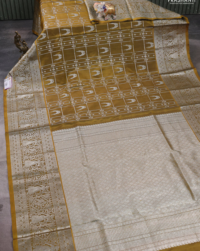 Venkatagiri silk saree mehendi green with allover silver zari checks & buttas and long silver zari woven border