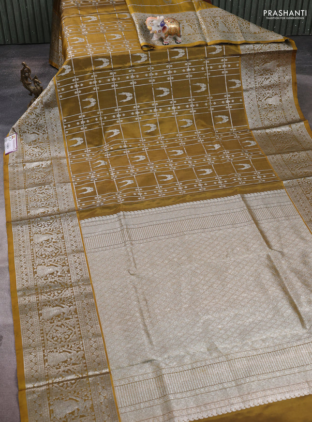 Venkatagiri silk saree mehendi green with allover silver zari checks & buttas and long silver zari woven border