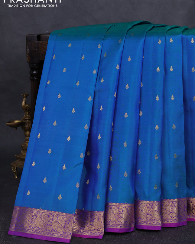 Pure kanchipuram silk saree dual tone blue and purple with allover zari woven buttas and zari woven annam border