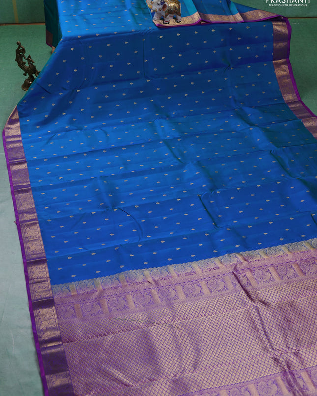 Pure kanchipuram silk saree dual tone blue and purple with allover zari woven buttas and zari woven annam border