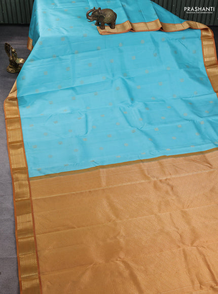 Pure kanchipuram silk saree light blue and dark mustard with annam & rudhraksha zari woven buttas and zari woven korvai border