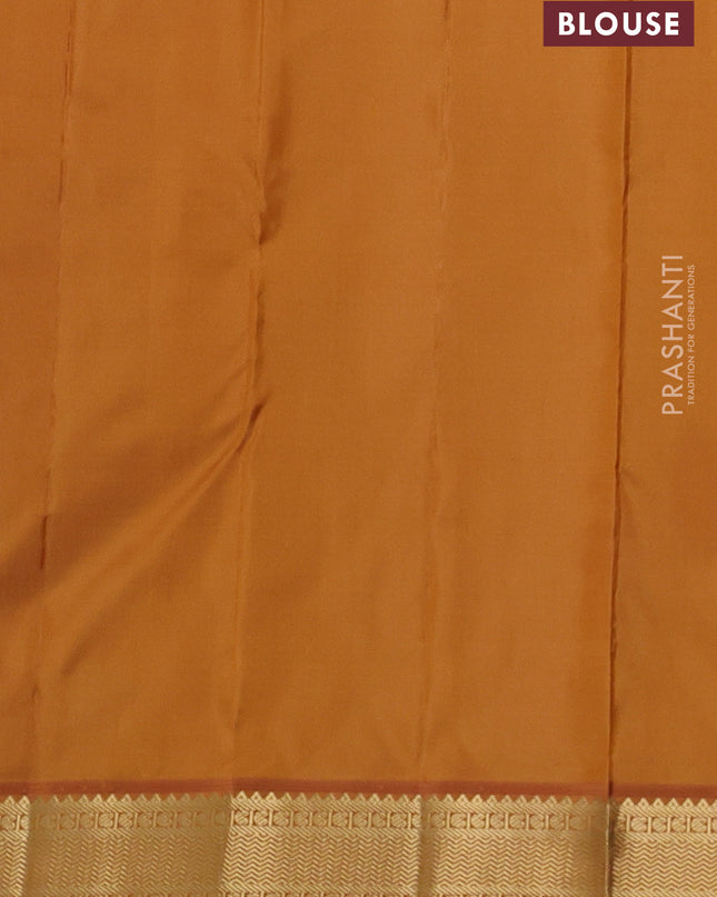 Pure kanchipuram silk saree light blue and dark mustard with annam & rudhraksha zari woven buttas and zari woven korvai border