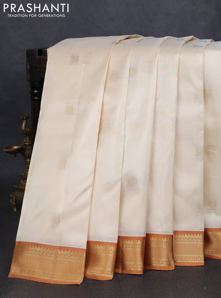 Pure kanchipuram silk saree cream and dark mustard with annam & rudhraksha zari woven buttas and zari woven korvai border