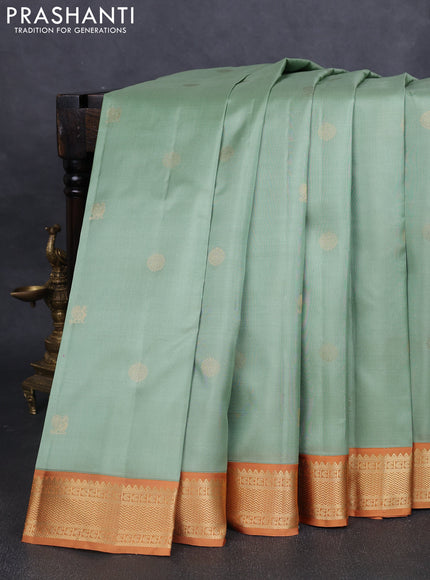 Pure kanchipuram silk saree pastel green and dark mustard with annam & rudhraksha zari woven buttas and zari woven korvai border