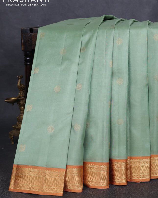 Pure kanchipuram silk saree pastel green and dark mustard with annam & rudhraksha zari woven buttas and zari woven korvai border
