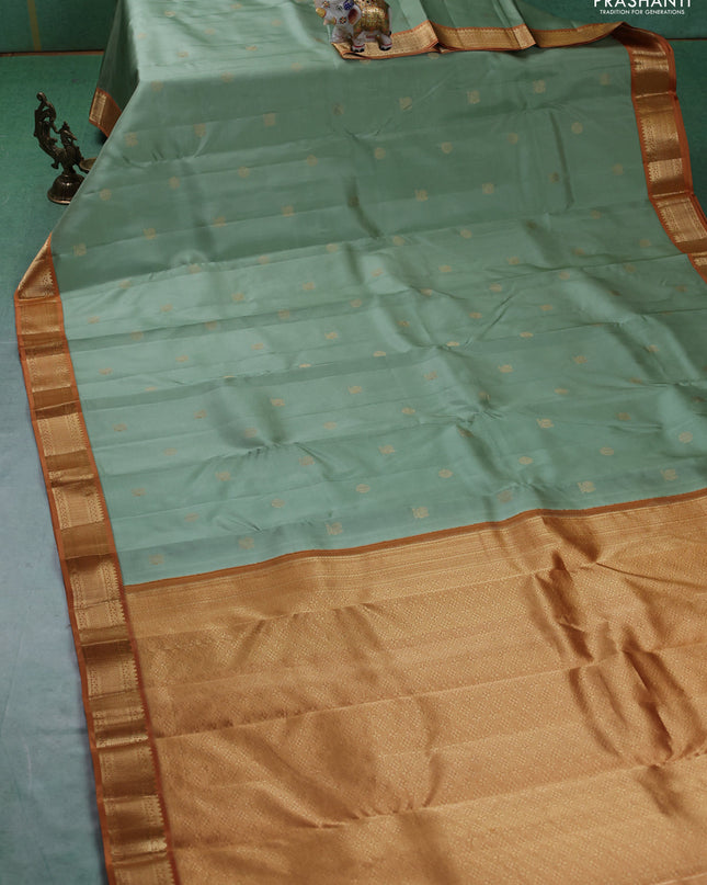 Pure kanchipuram silk saree pastel green and dark mustard with annam & rudhraksha zari woven buttas and zari woven korvai border