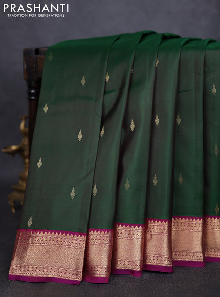 Pure kanchipuram silk saree bottle green and purple with zari woven buttas and zari woven korvai border