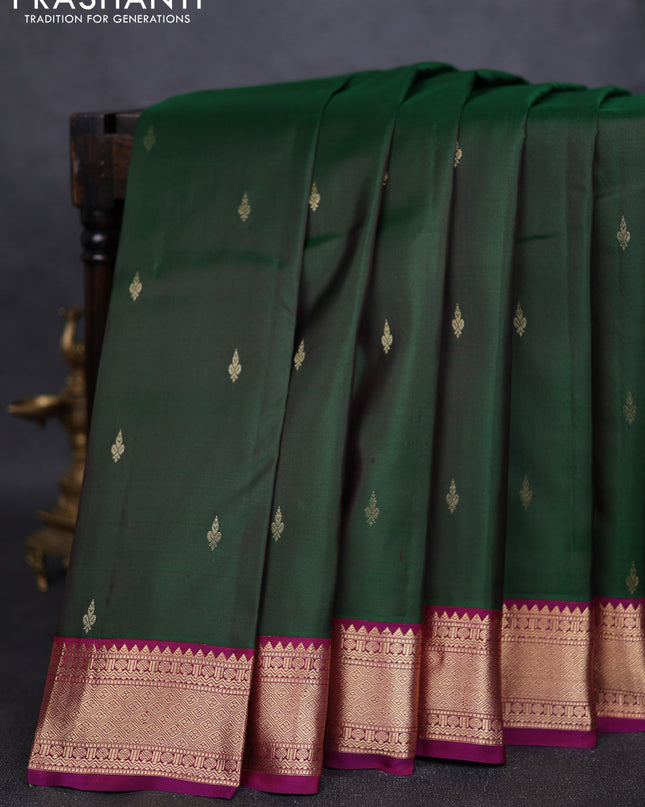 Pure kanchipuram silk saree bottle green and purple with zari woven buttas and zari woven korvai border