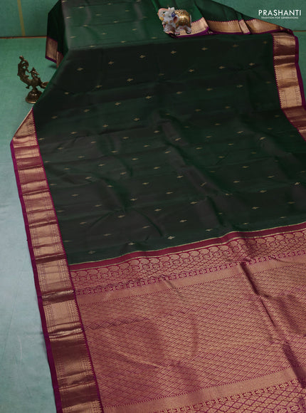 Pure kanchipuram silk saree bottle green and purple with zari woven buttas and zari woven korvai border