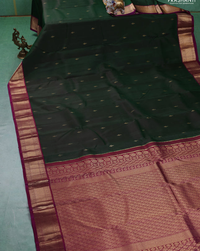 Pure kanchipuram silk saree bottle green and purple with zari woven buttas and zari woven korvai border