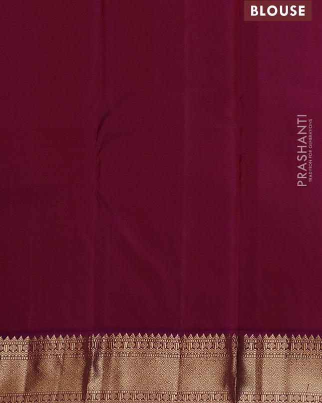 Pure kanchipuram silk saree bottle green and purple with zari woven buttas and zari woven korvai border