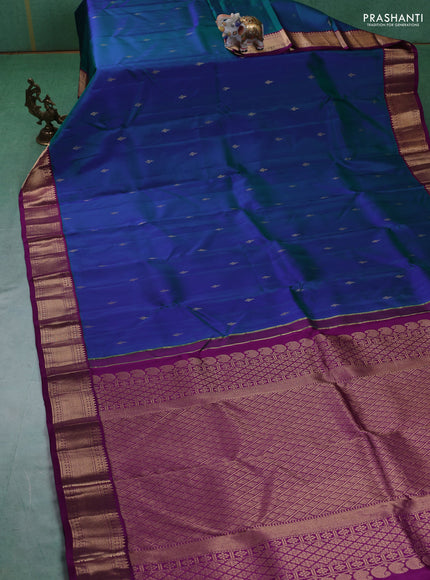 Pure kanchipuram silk saree dual tone bluish green and purple with zari woven buttas and zari woven korvai border