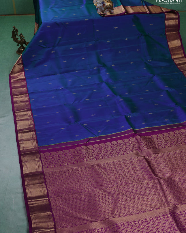 Pure kanchipuram silk saree dual tone bluish green and purple with zari woven buttas and zari woven korvai border