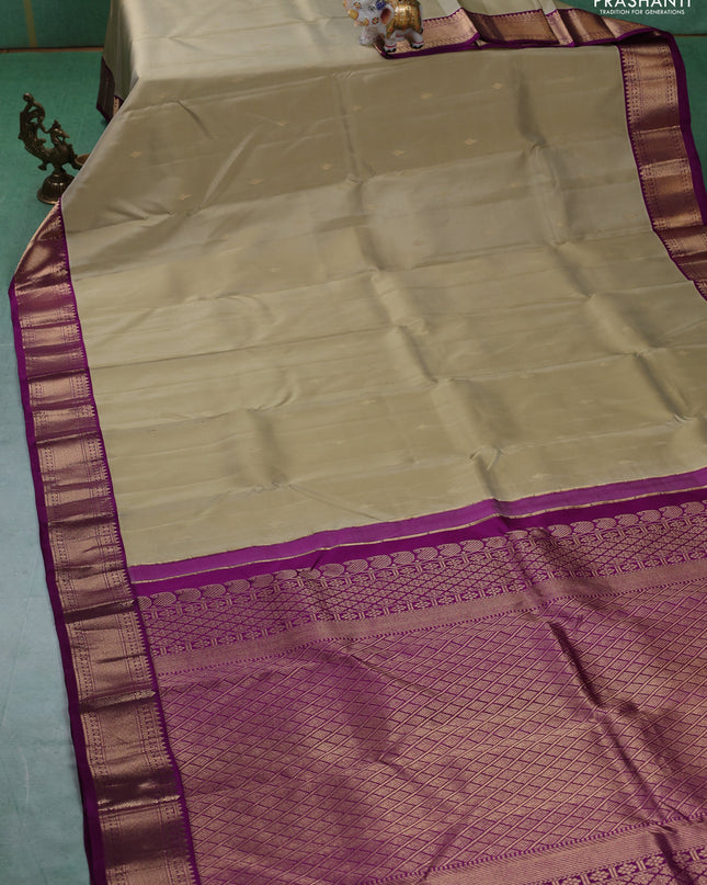 Pure kanchipuram silk saree elaichi green and purple with zari woven buttas and zari woven korvai border