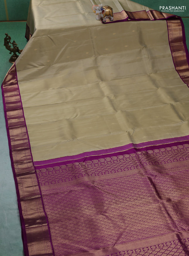 Pure kanchipuram silk saree elaichi green and purple with zari woven buttas and zari woven korvai border