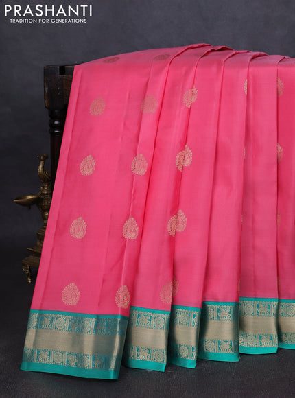 Pure kanchipuram silk saree peach pink and teal green with annam zari woven buttas and zari woven korvai border