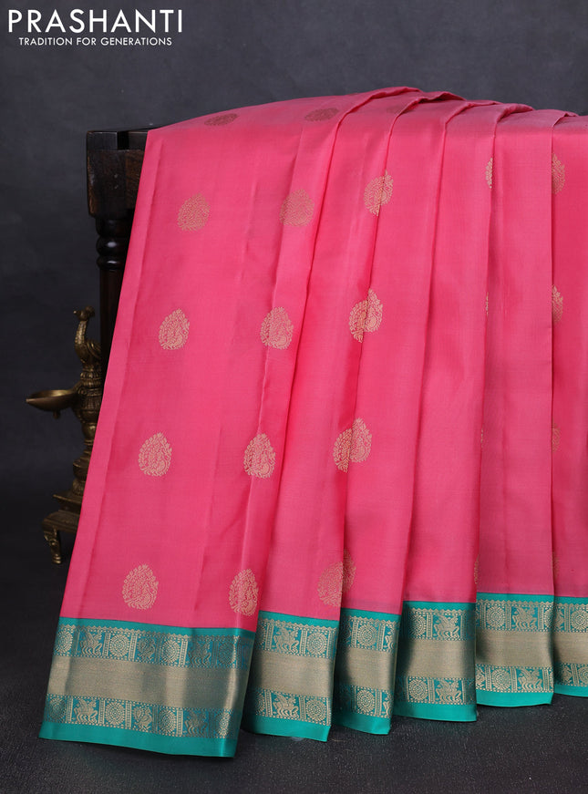 Pure kanchipuram silk saree peach pink and teal green with annam zari woven buttas and zari woven korvai border