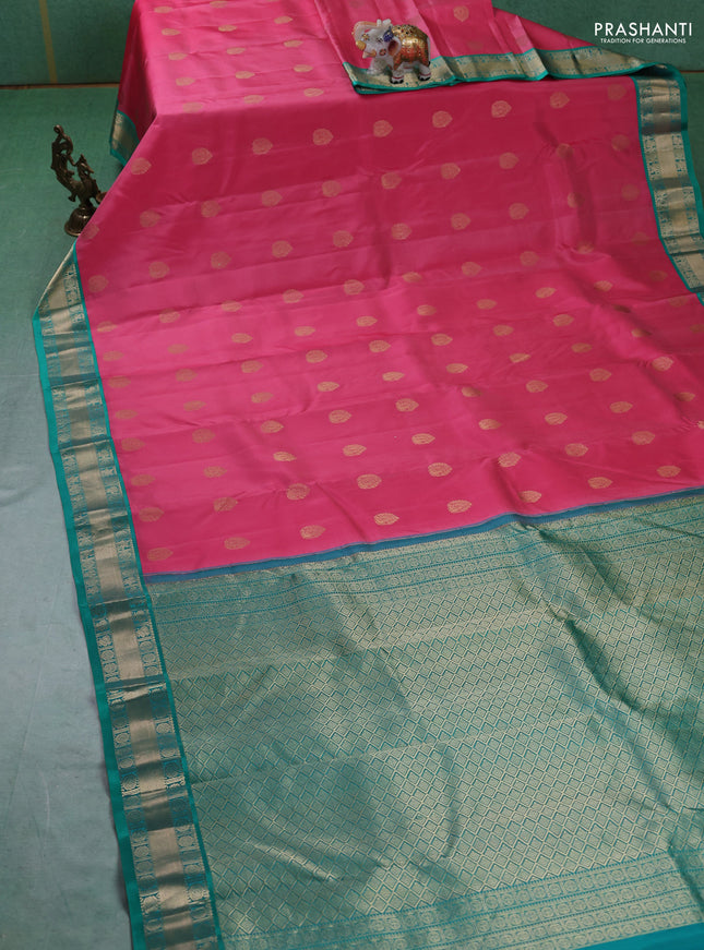 Pure kanchipuram silk saree peach pink and teal green with annam zari woven buttas and zari woven korvai border