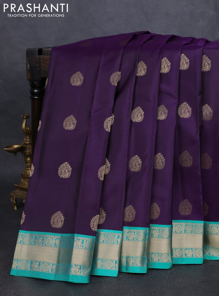 Pure kanchipuram silk saree dark purple and teal green with annam zari woven buttas and zari woven korvai border