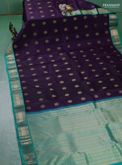 Pure kanchipuram silk saree dark purple and teal green with annam zari woven buttas and zari woven korvai border