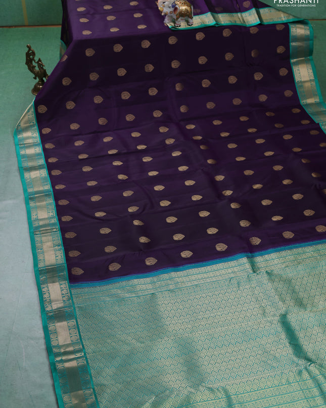 Pure kanchipuram silk saree dark purple and teal green with annam zari woven buttas and zari woven korvai border