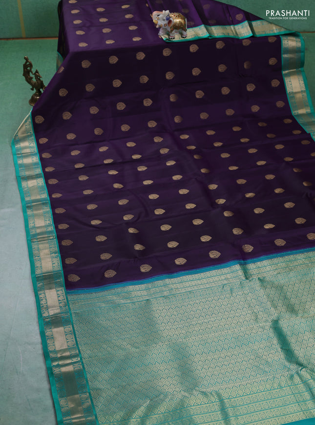 Pure kanchipuram silk saree dark purple and teal green with annam zari woven buttas and zari woven korvai border