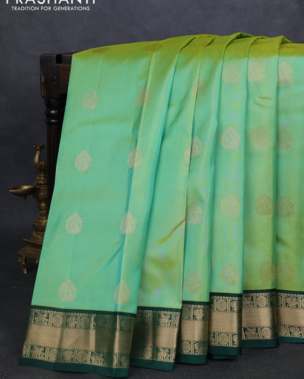 Pure kanchipuram silk saree pista green and green with annam zari woven buttas and zari woven korvai border