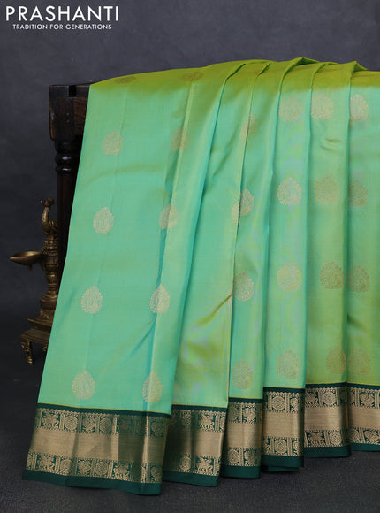 Pure kanchipuram silk saree pista green and green with annam zari woven buttas and zari woven korvai border