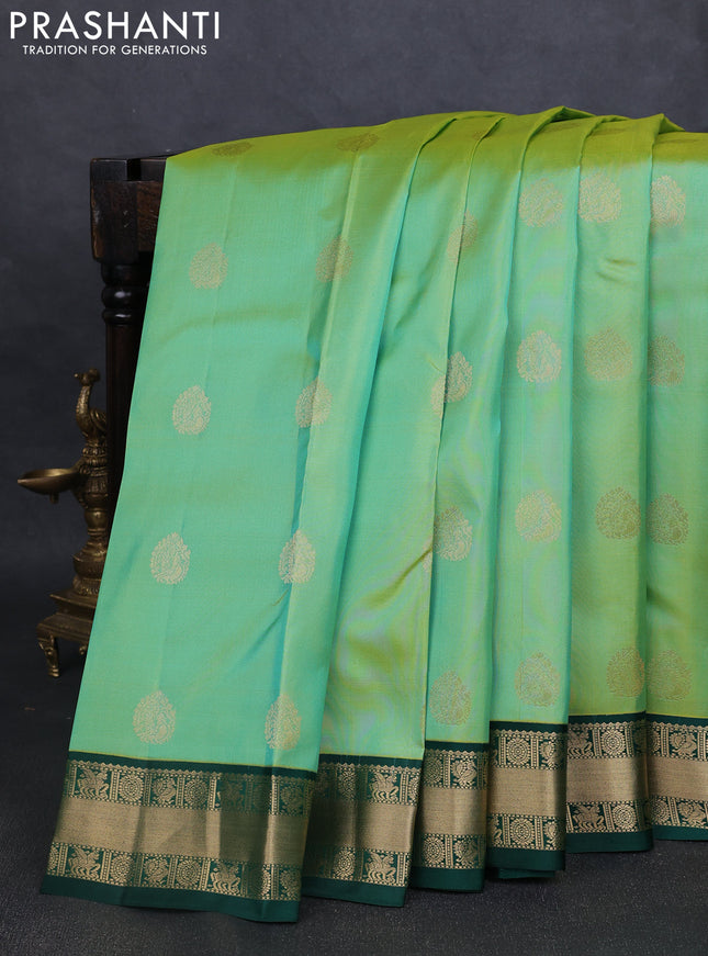 Pure kanchipuram silk saree pista green and green with annam zari woven buttas and zari woven korvai border