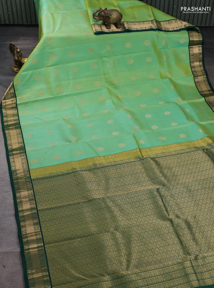Pure kanchipuram silk saree pista green and green with annam zari woven buttas and zari woven korvai border