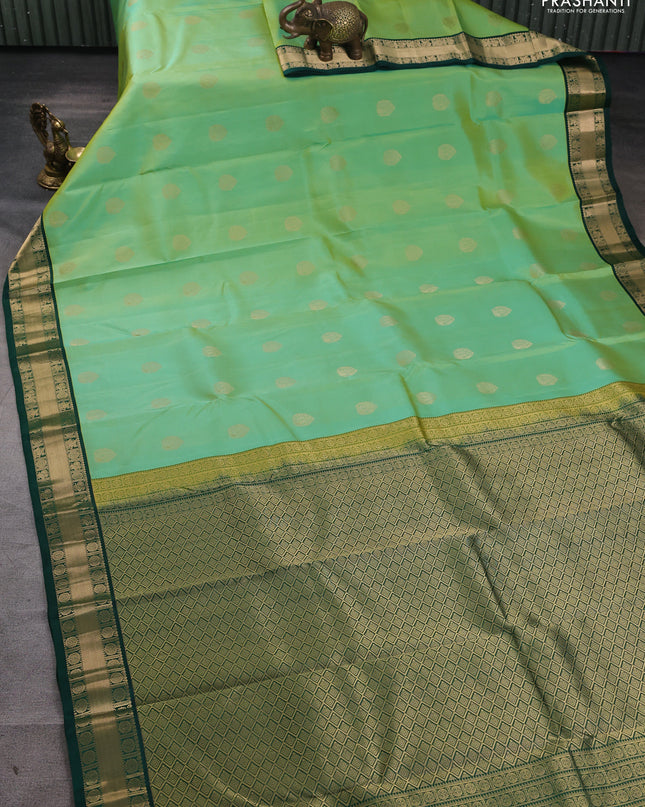 Pure kanchipuram silk saree pista green and green with annam zari woven buttas and zari woven korvai border