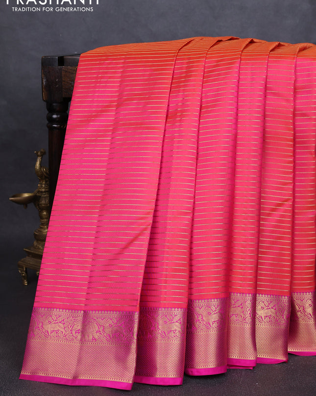 Pure kanchipuram silk saree dual tone pinkish orange and pink with allover zari stripe pattern and rich zari woven border