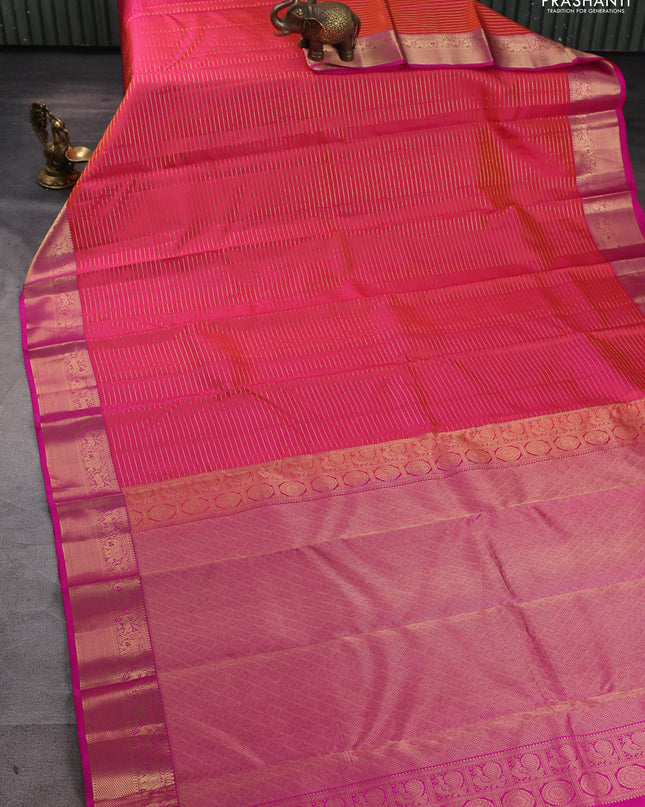 Pure kanchipuram silk saree dual tone pinkish orange and pink with allover zari stripe pattern and rich zari woven border