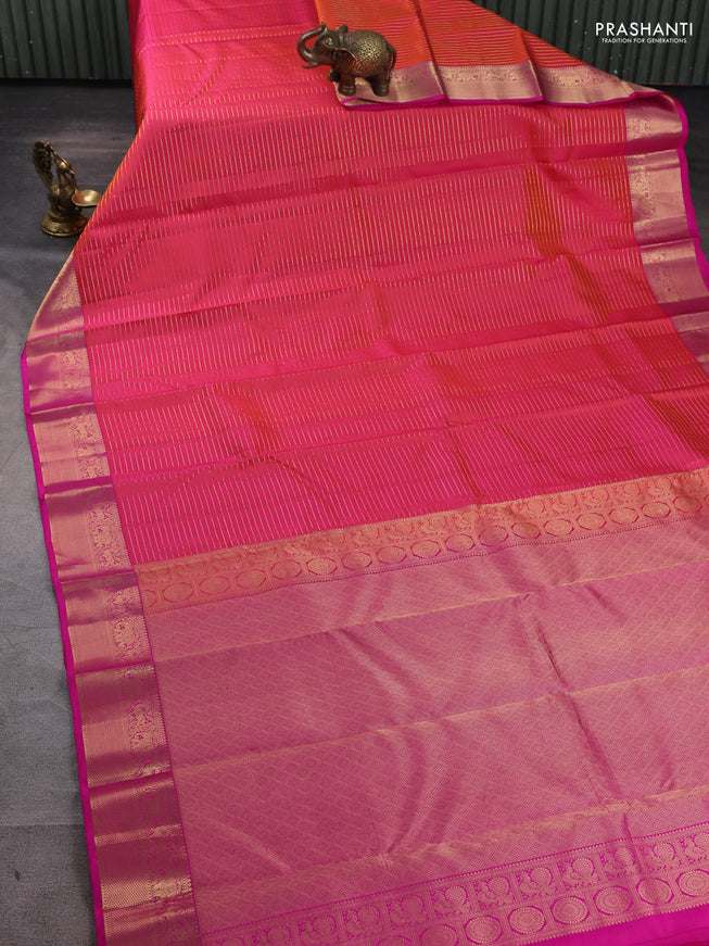 Pure kanchipuram silk saree dual tone pinkish orange and pink with allover zari stripe pattern and rich zari woven border
