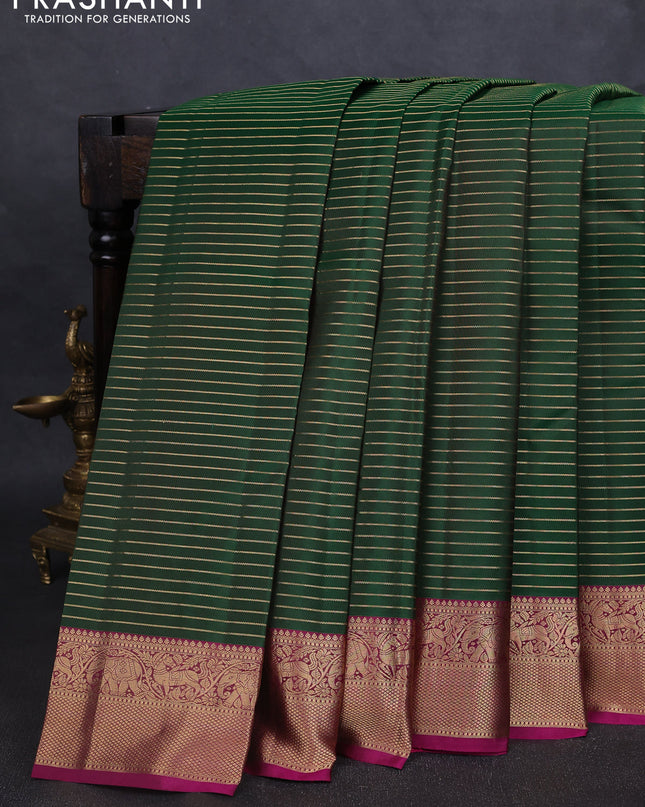 Pure kanchipuram silk saree green and magenta pink with allover zari stripe pattern and rich zari woven border